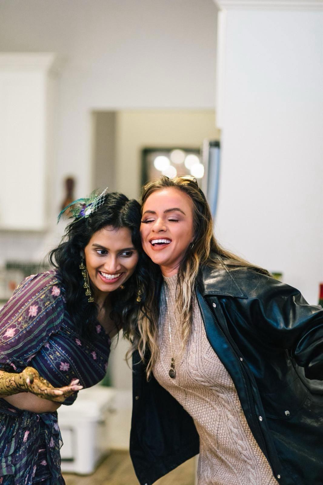 Candid shot of Founder Danielle Lampron laughing and hugging a client, demonstrating the personal trust built during planning.