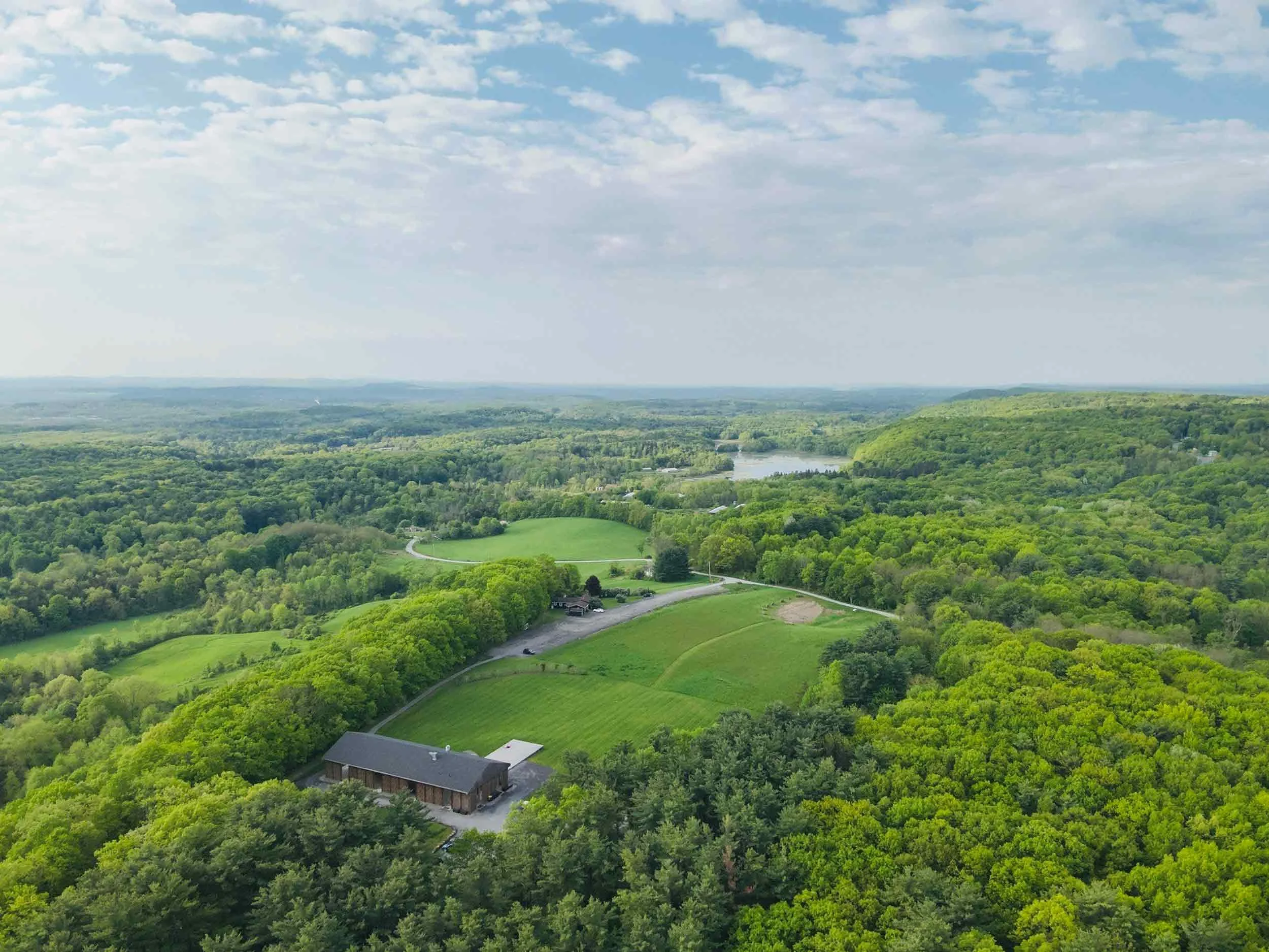 Aerial view of a lush green estate venue available for New York private events.
