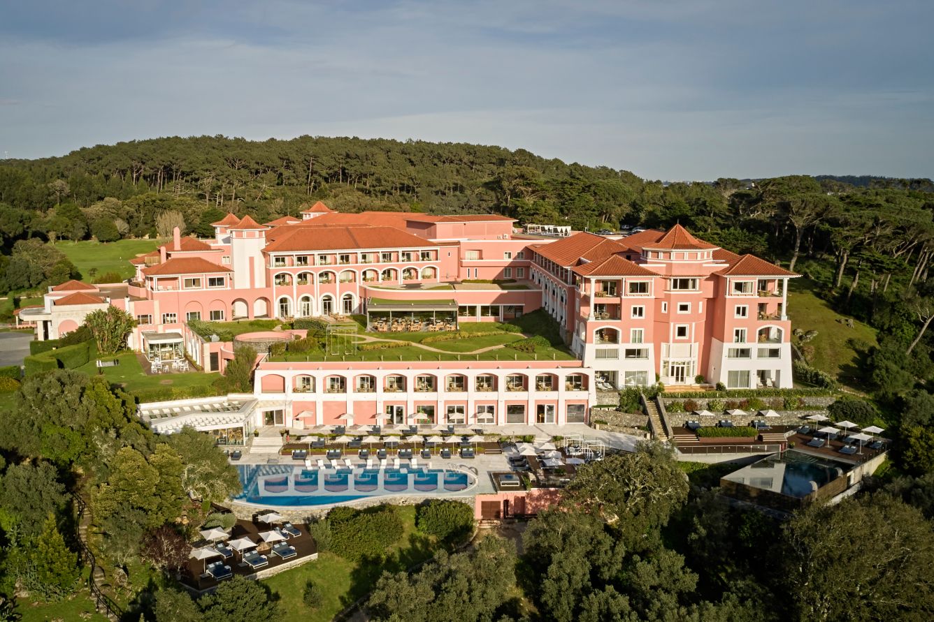 Aerial view of a pink historic luxury resort available for Portugal weddings.