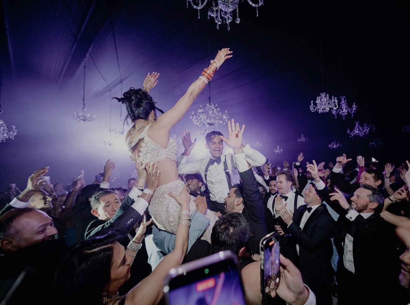 High-energy luxury wedding reception with professional lighting, CO2 effects, and live entertainment produced by DTL EVNTS.