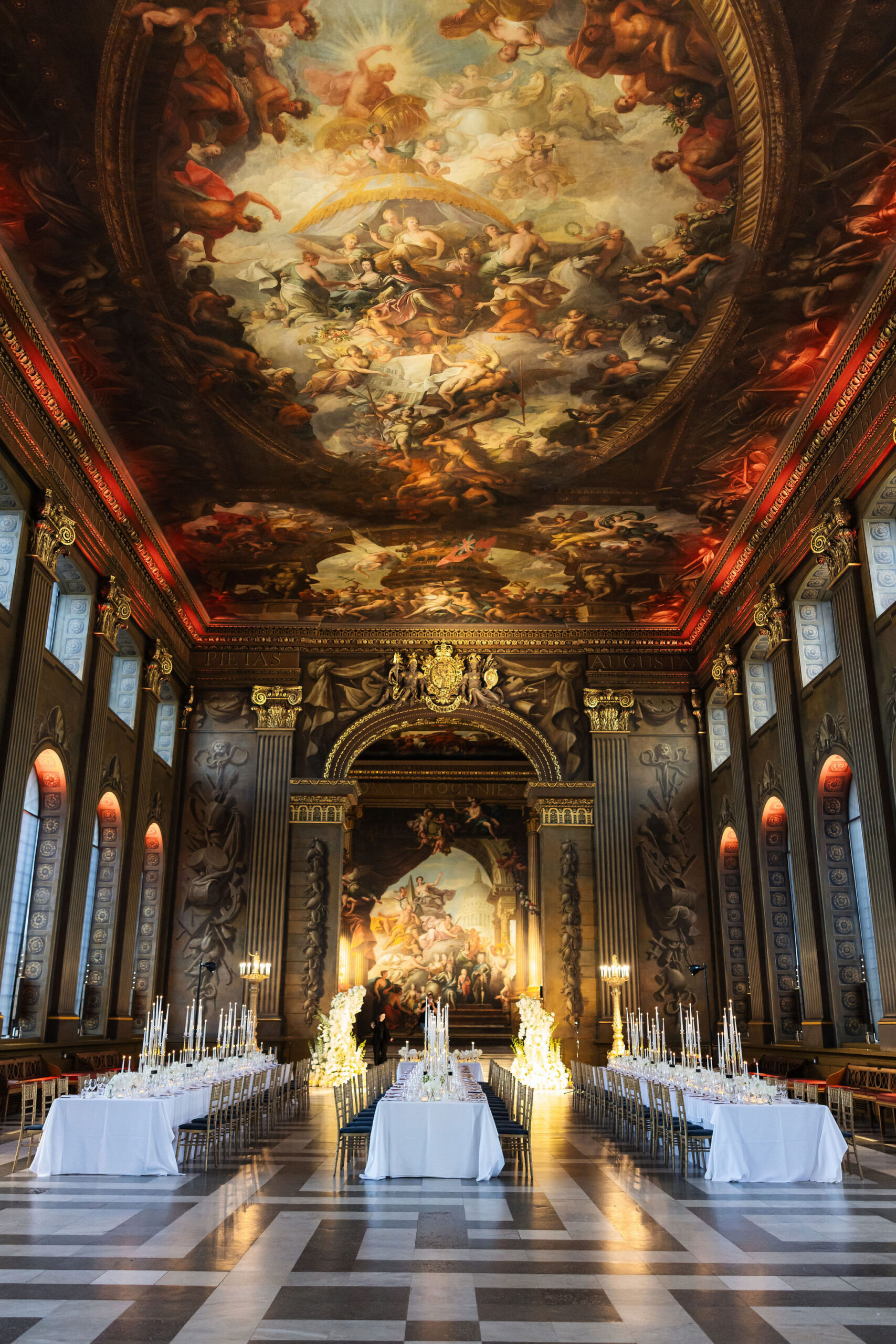 Luxury London wedding reception design with dramatic architecture and candlelit atmosphere