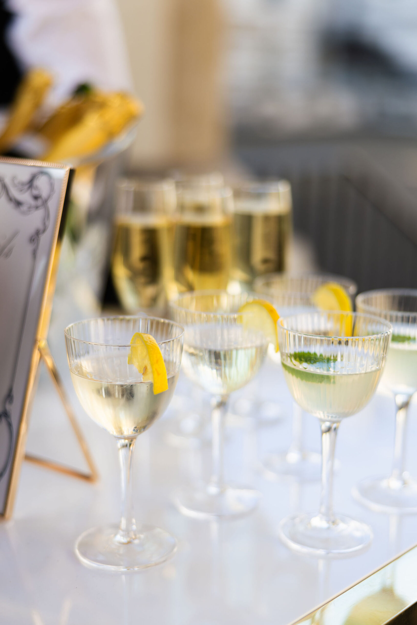Champagne and citrus cocktail detail at a luxury wedding celebration
